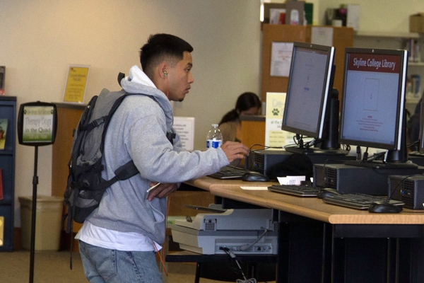 A student working on the library computer