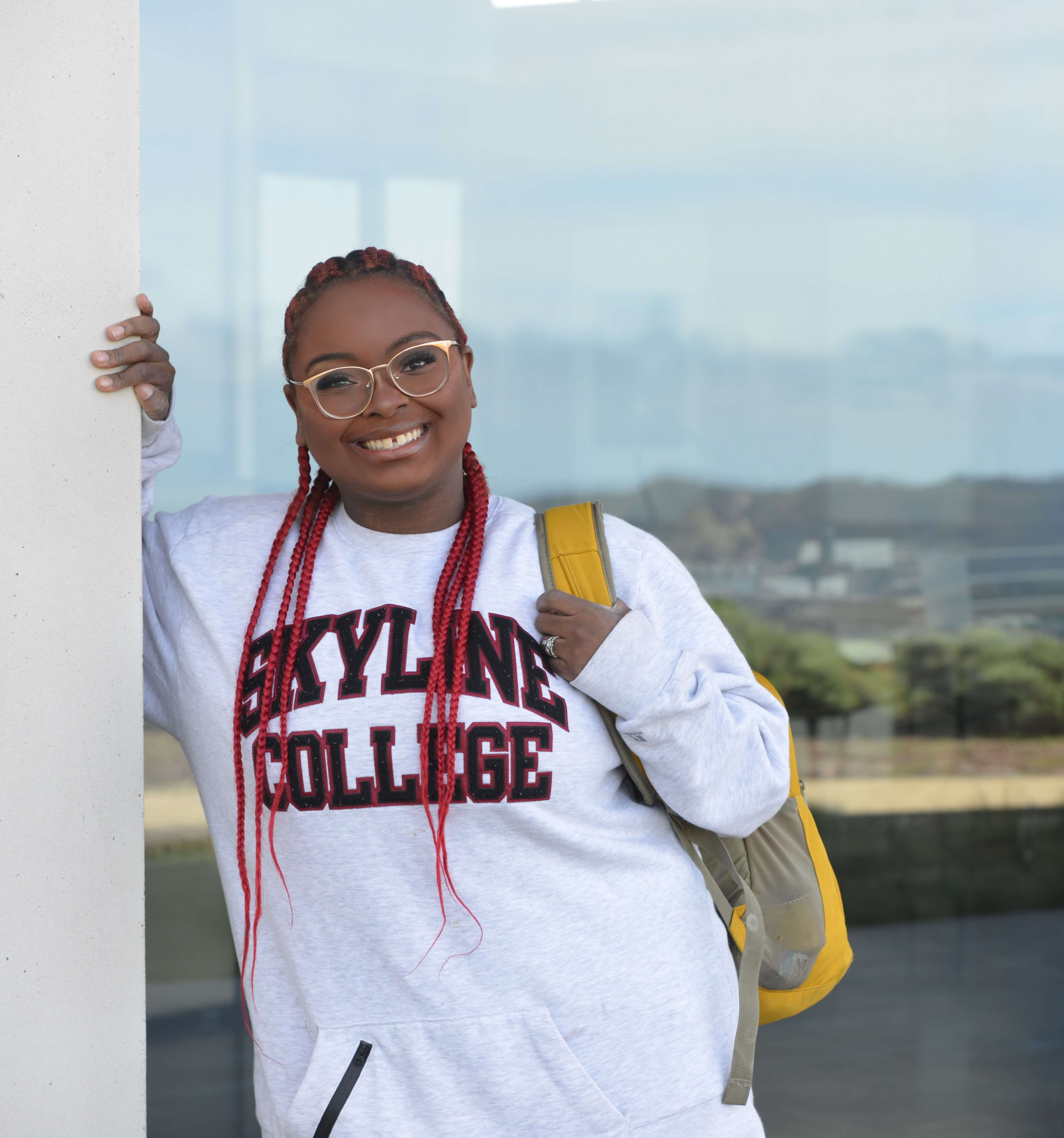 smiling student in Skyline College sweatshirt