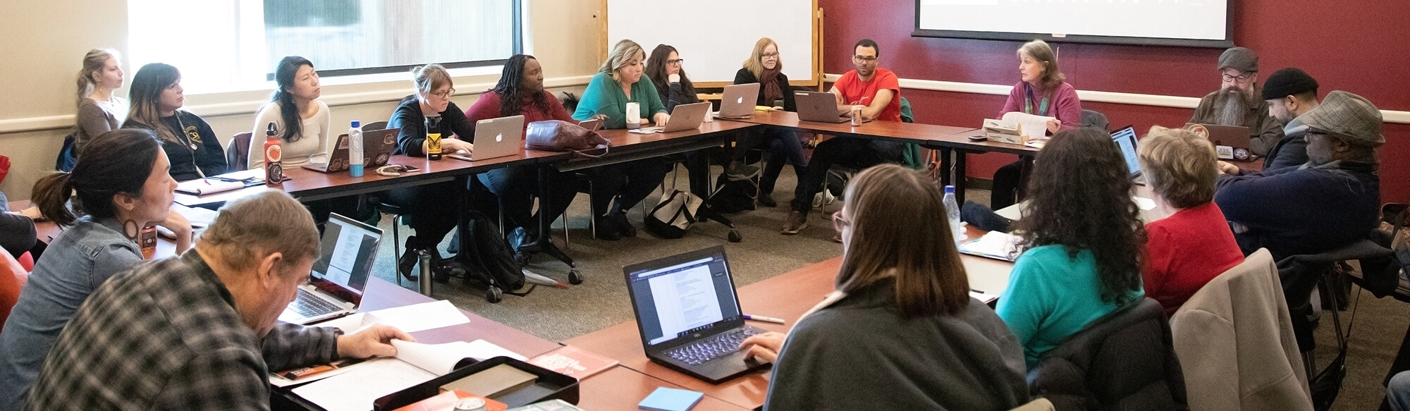 members of the academic senate in a meeting