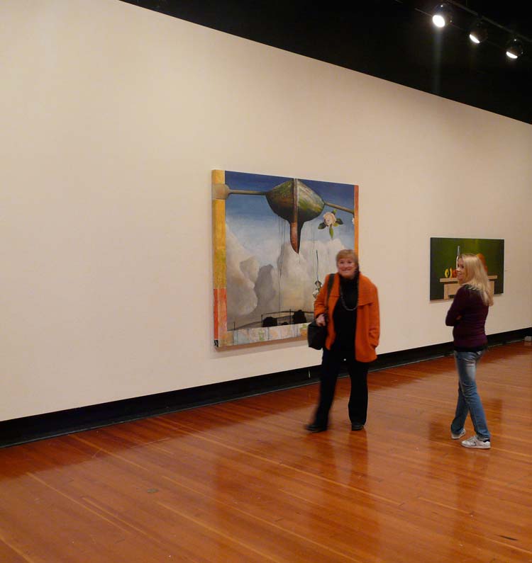 Gallery visitors in front of the Exodus painting
