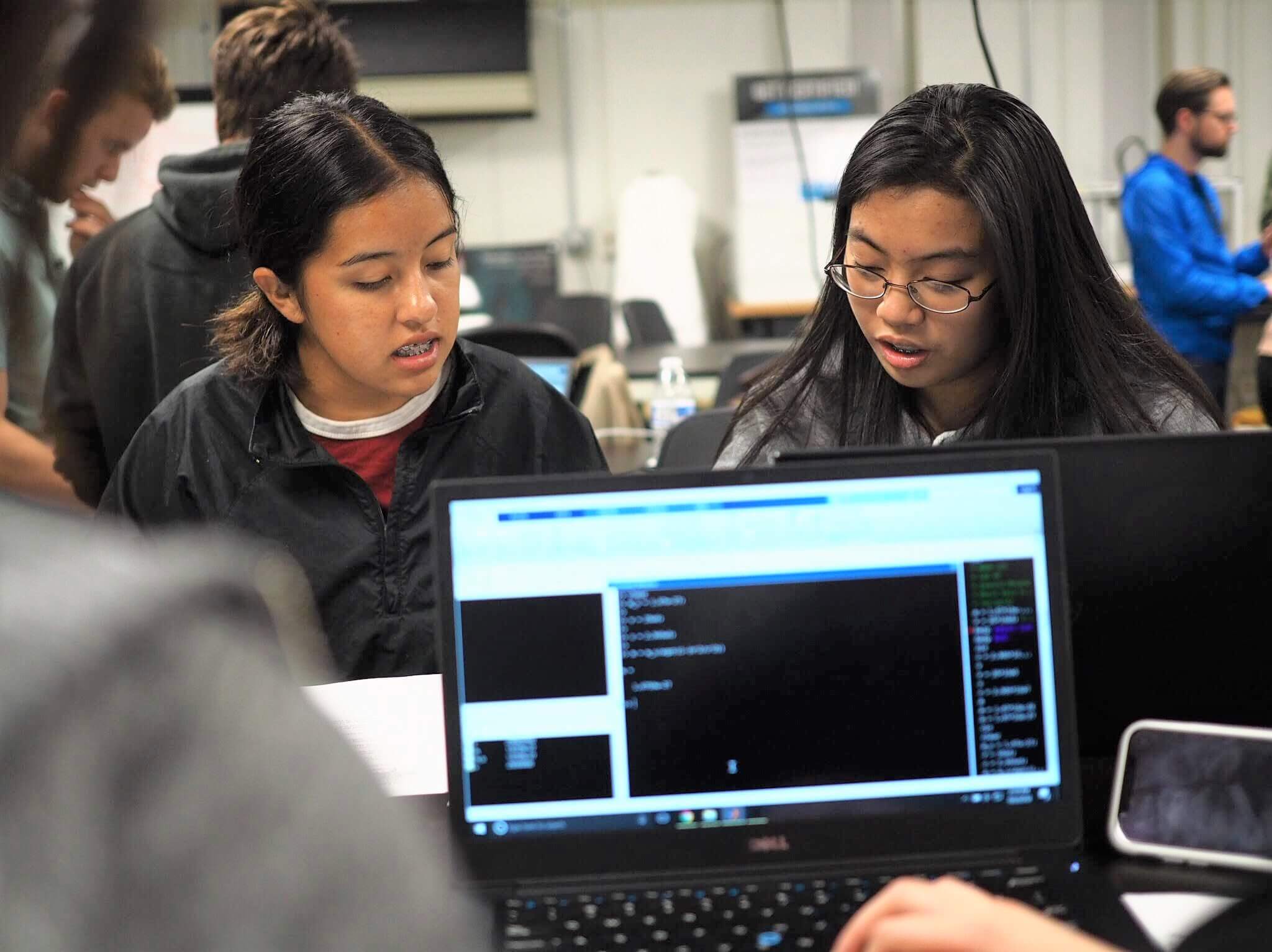 two students work together in a computer science lab
