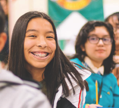 JumpStart student smiles at the camera