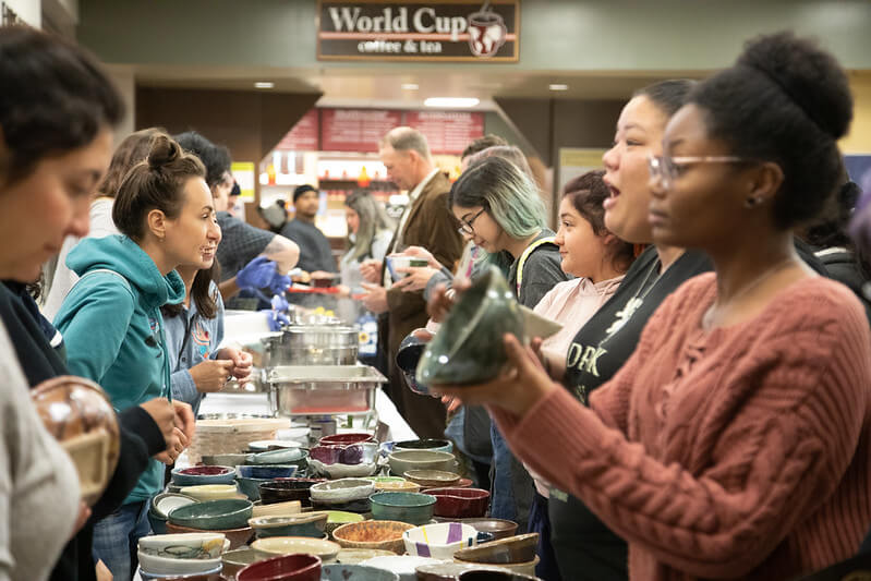 People lining up at the Empty Bowls Fundraiser by the Art Department