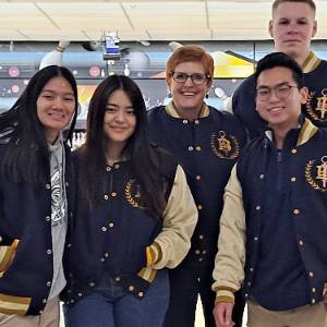 Psi Beta students in letterman jackets