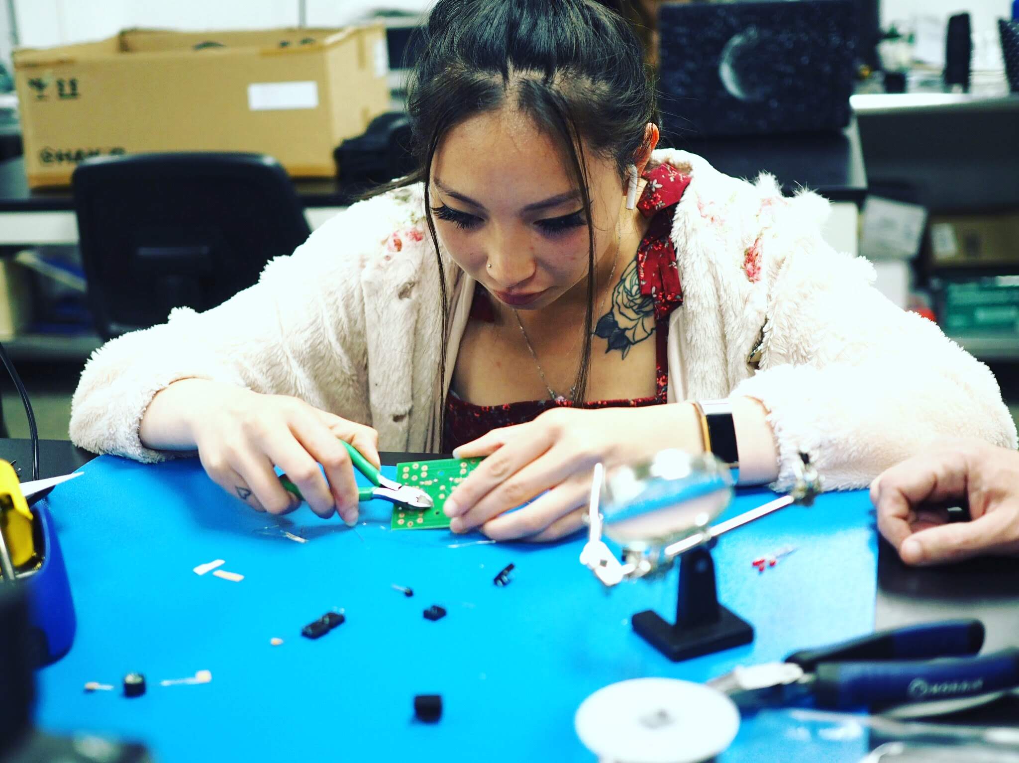 Student working on a circuit board