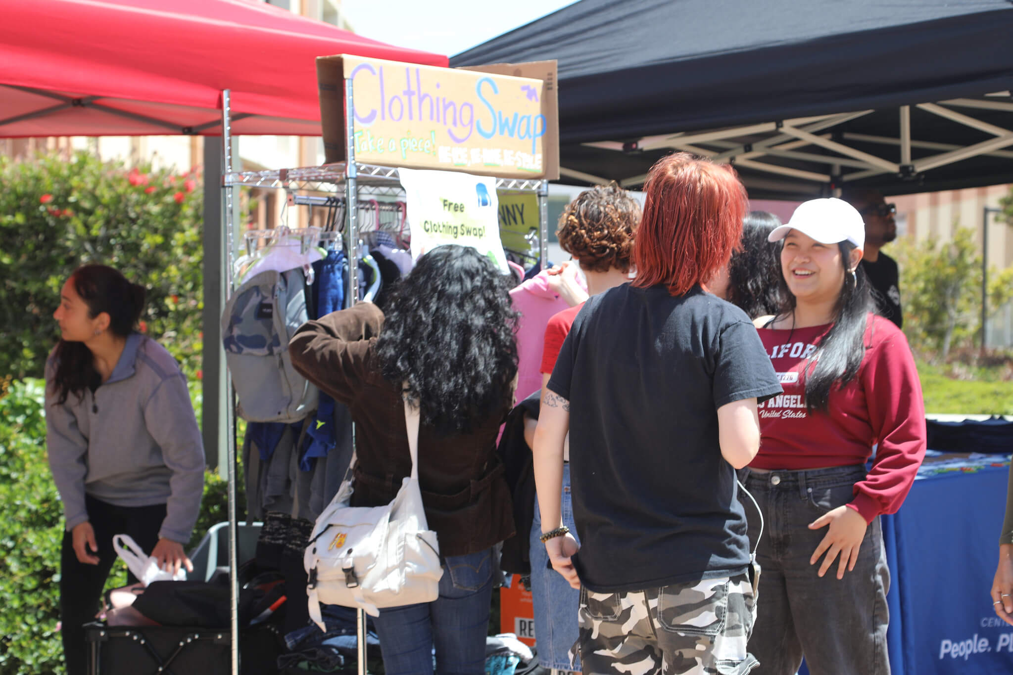 students at a clothing swap in the quad