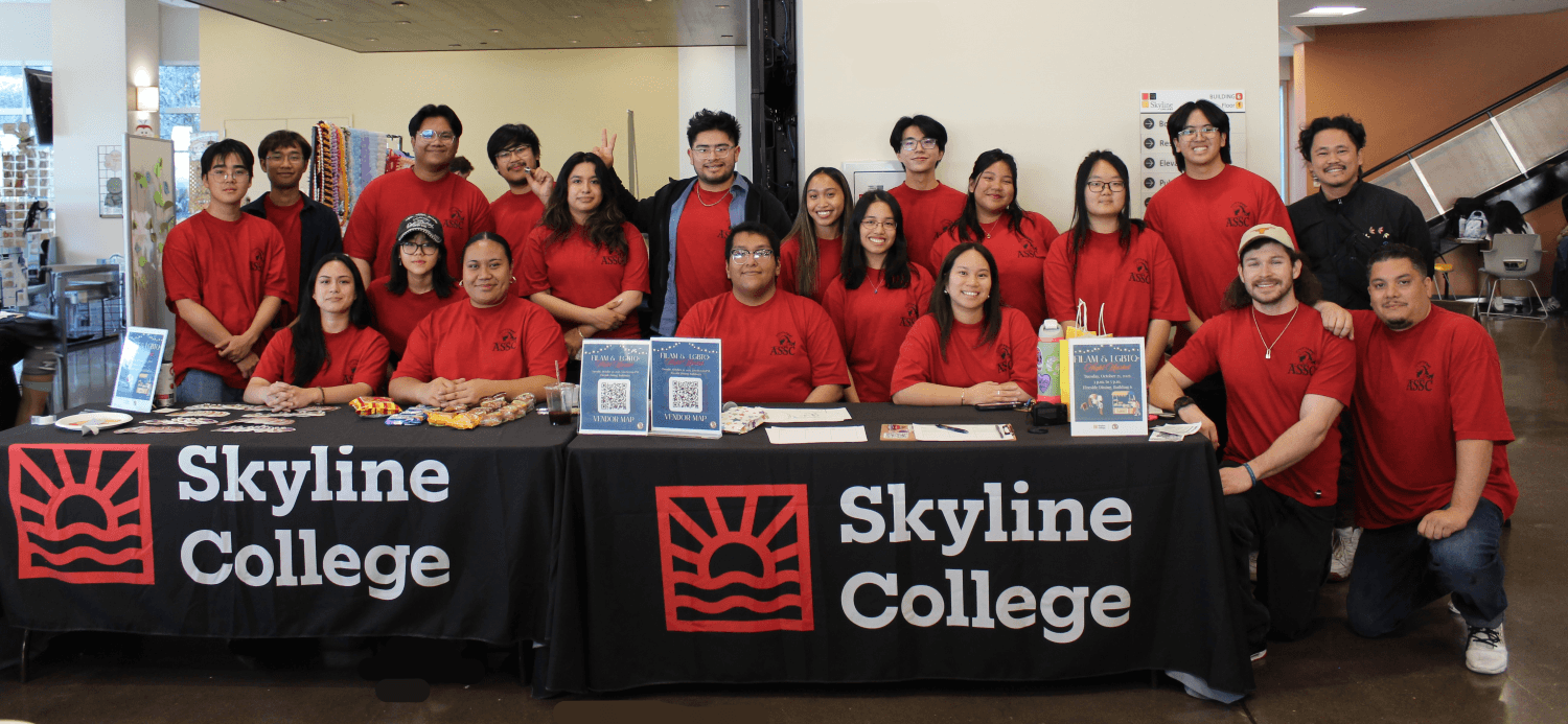 current ASSC government group photo, wearing matching red shirts at a Skyline College table