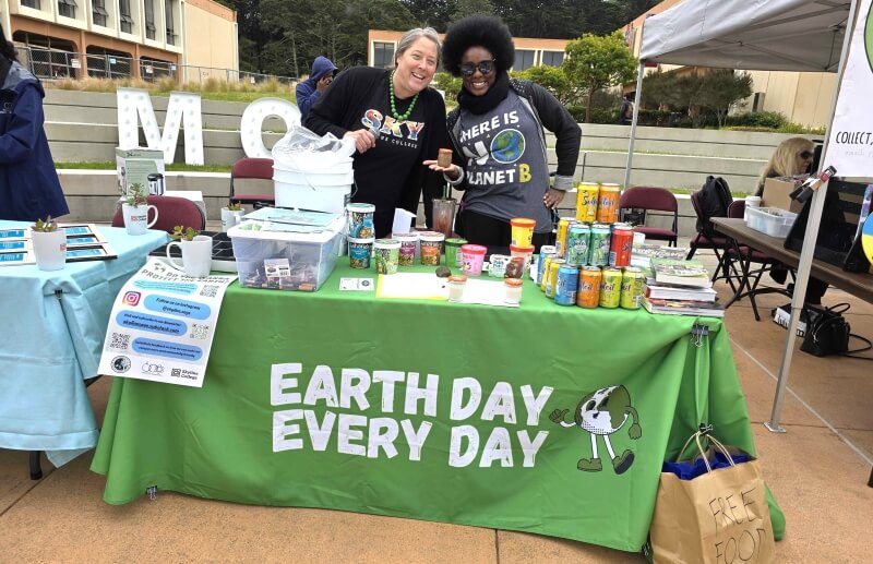 Sustainability Committee members staff a table at Earth Fest