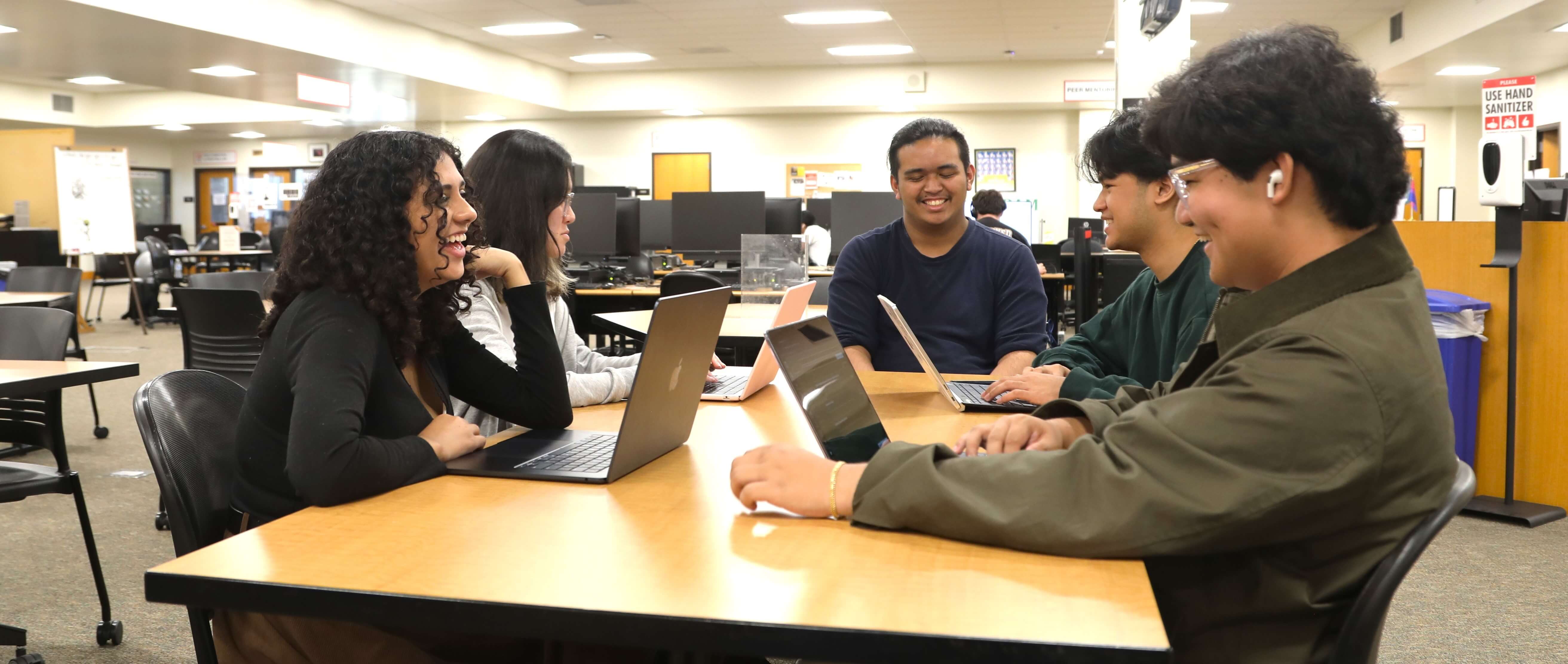a student tutor helps someone at the learning center